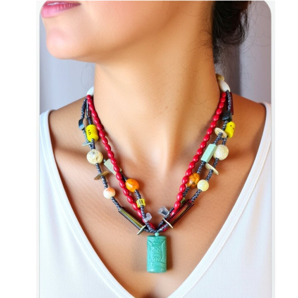 Boho inspired, handcrafted necklace with a  a jade green carved stone pendant